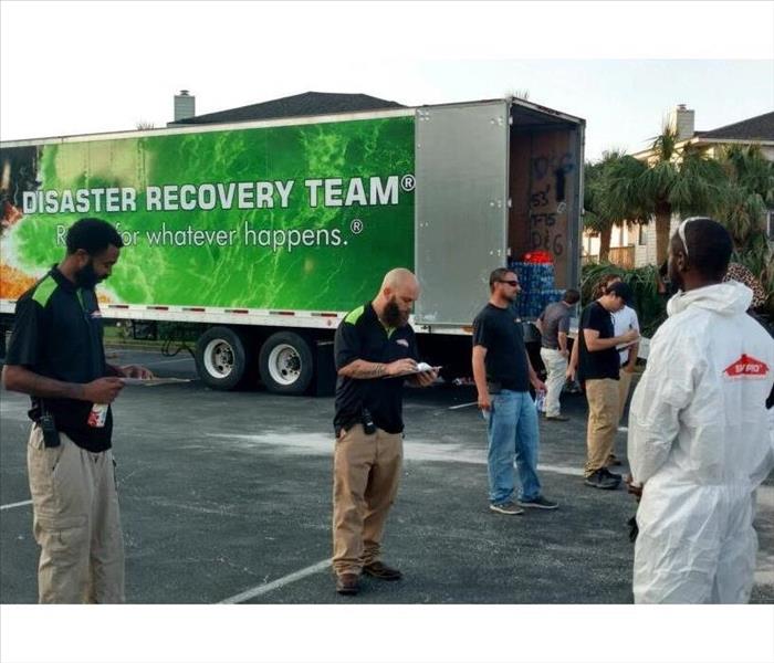 Our team gathered in a parking lot to receive instructions following Hurricane Florence.