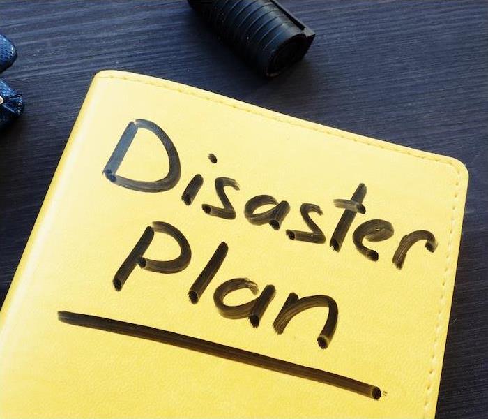 yellow folder with disaster plan on it